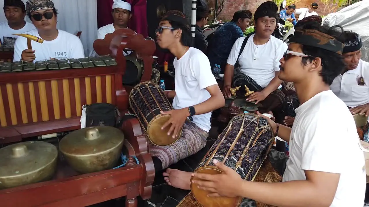 Traditional Asian Gamelan Music Group Plays Live at Bali Wedding Indonesia Gong Drums and Ancient Bronze Musical Instruments