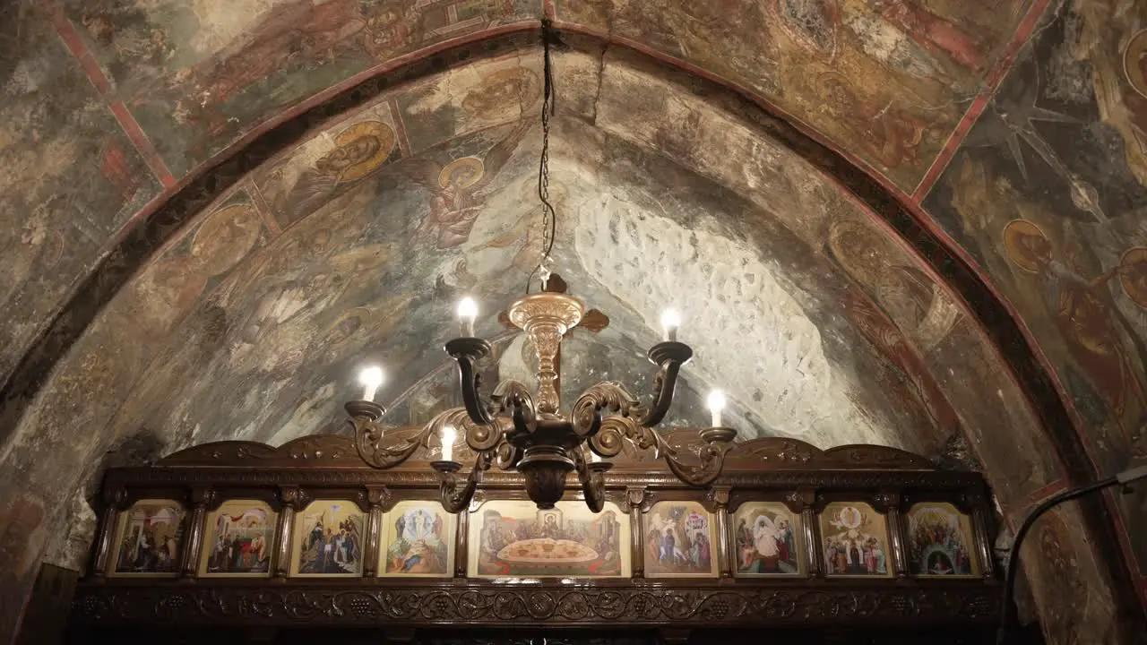 Greek orthodox church interior shot shows the church dome and chapel with beautiful hagiography