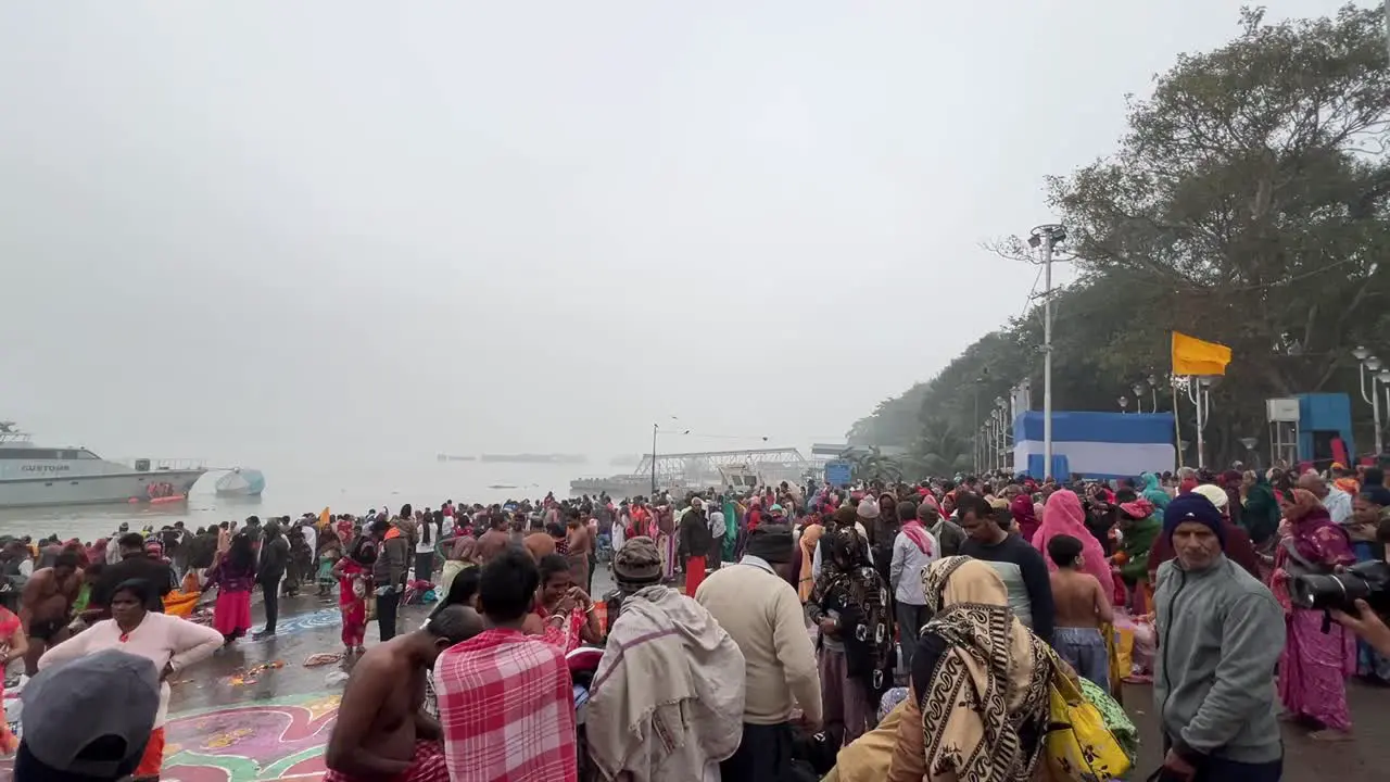 Wide angle view of crowd of Hindus bathing in Babu ghat Kolkata for the celebration of Sankranti festival in India