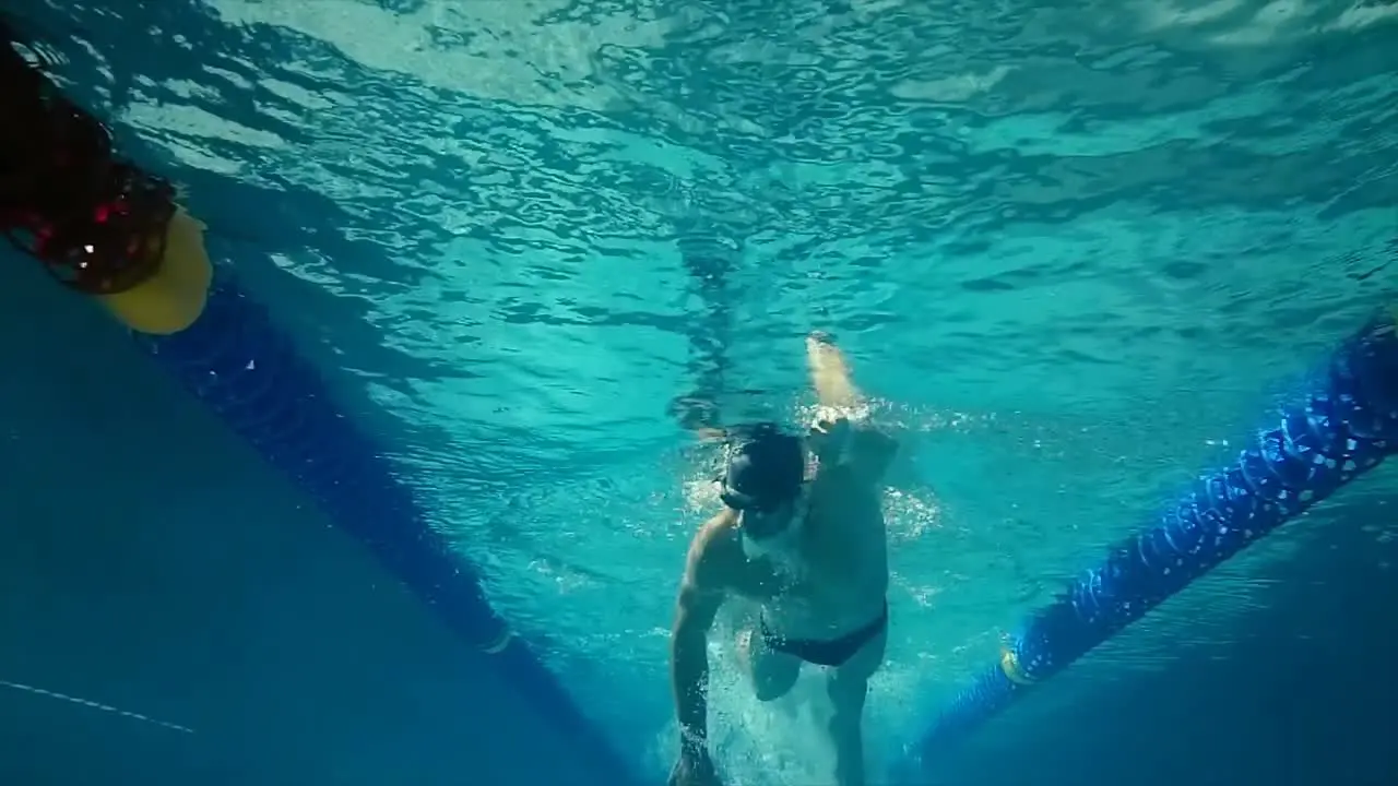 Underwater view of man swimming