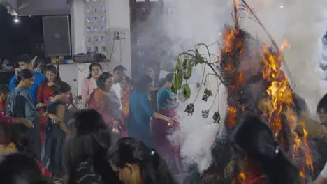 People Celebrating Hindu Festival Of Holi With Bonfire In Mumbai India