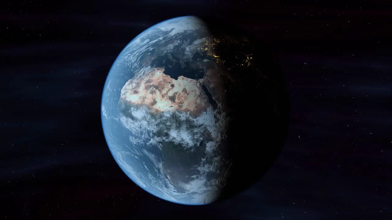 Planet Earth In Space Rotates From Day Into Night As City Lights Turn On (Loop)