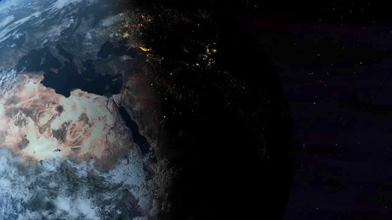 The Planet Earth Rotates From Day Into Night As City Lights Turn On (Loop)