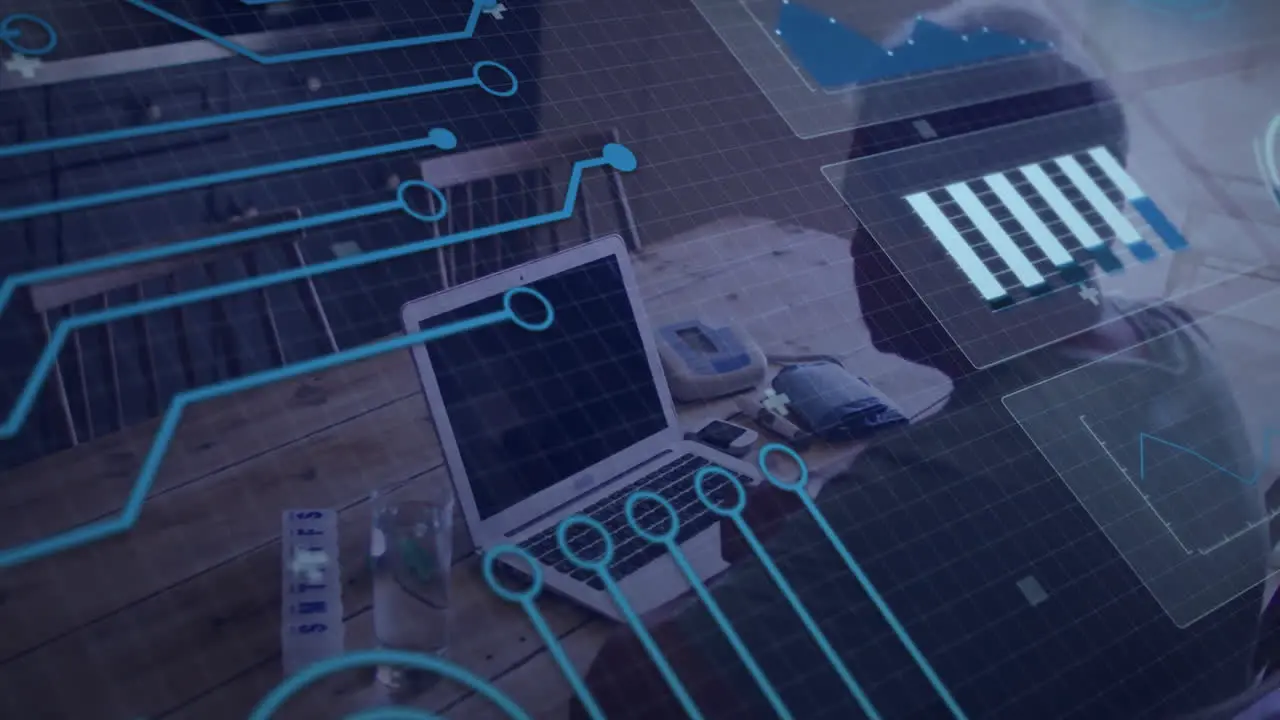 Animation of diagrams and connections over biracial man using laptop with copy space