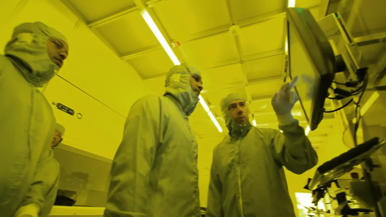 Low angle view of a group of doctors in a billable looking at a screen