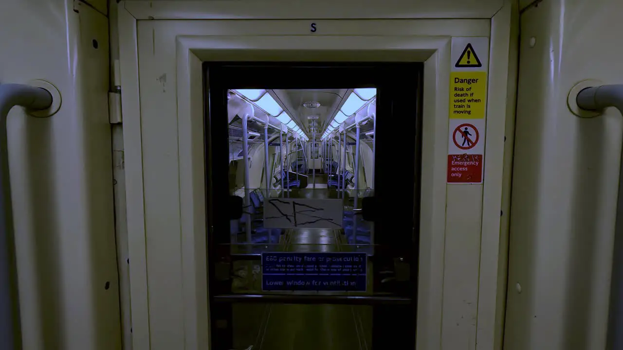 Looking Through Door Connecting To Another Empty Train Carriage On The Jubilee Line Train In London