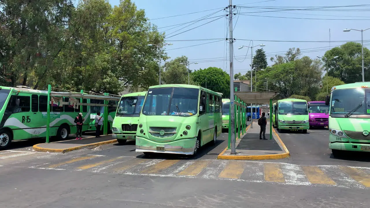 Row Of Traditional Mexican green public transport bus La Buseta At Mexico City Bus Station