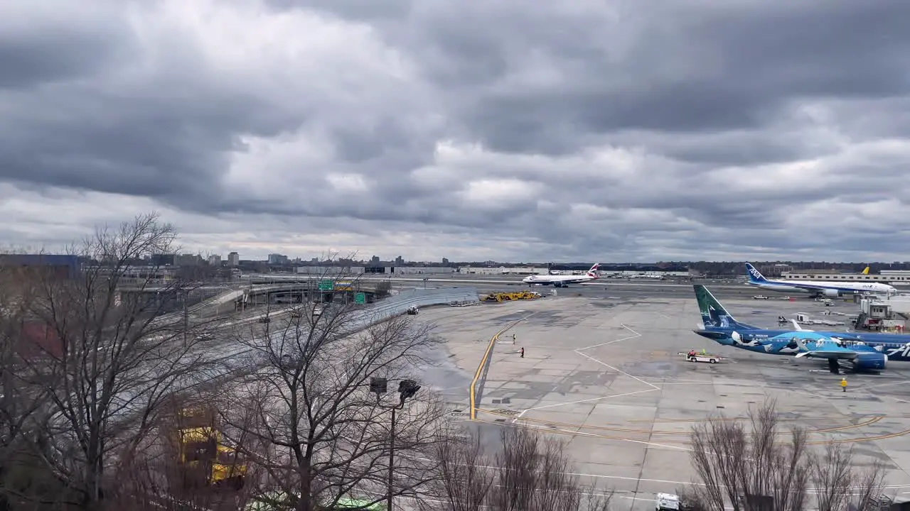 SLOW MOTION SHOT OF TERMINAL 3 JFK AIRport during cloudy day from train