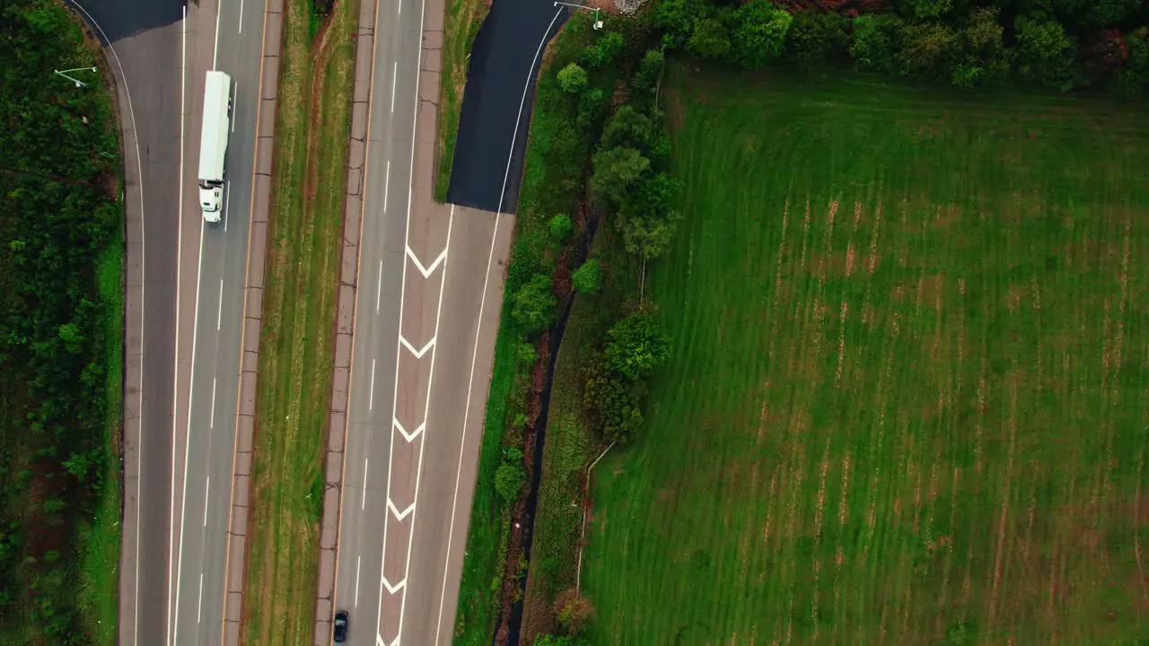 Aerial top down view Semi trucks on a country highway