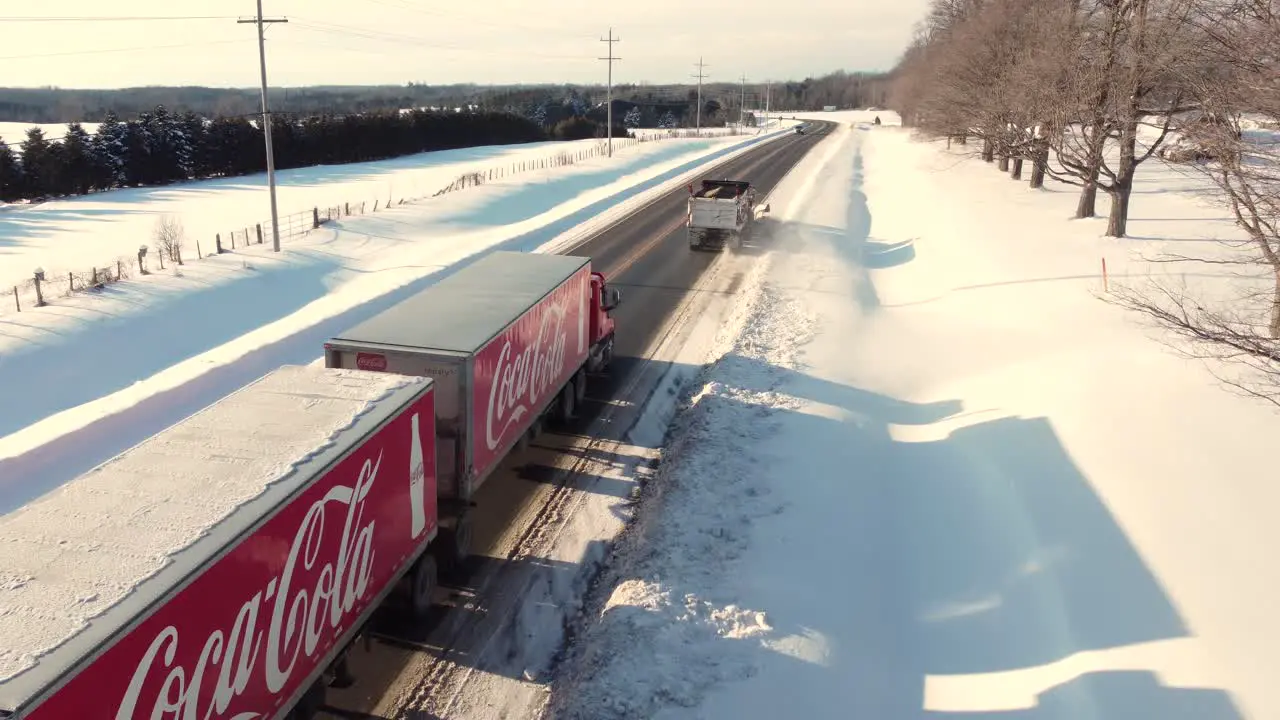 Aerial view of a Coca Cola truck on the highway during the winter holiday season