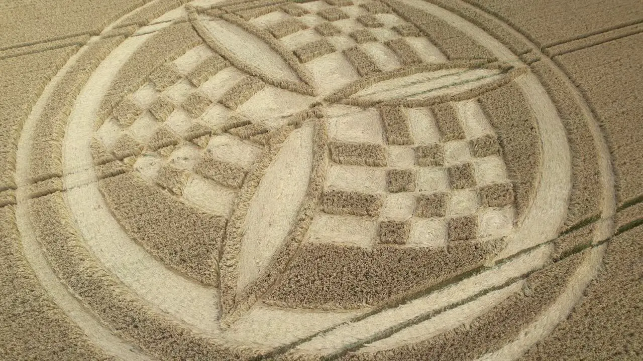 South Wonston trinity propeller crop circle aerial view circling the design on Hampshire golden wheat field farmland