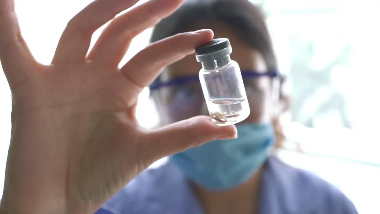 Female biologist Close up woman doctor in laboratory analyzing a test tube