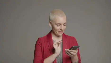 Female model posing with smartphone during studio portrait 03