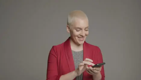 Female model posing with smartphone during studio portrait 02