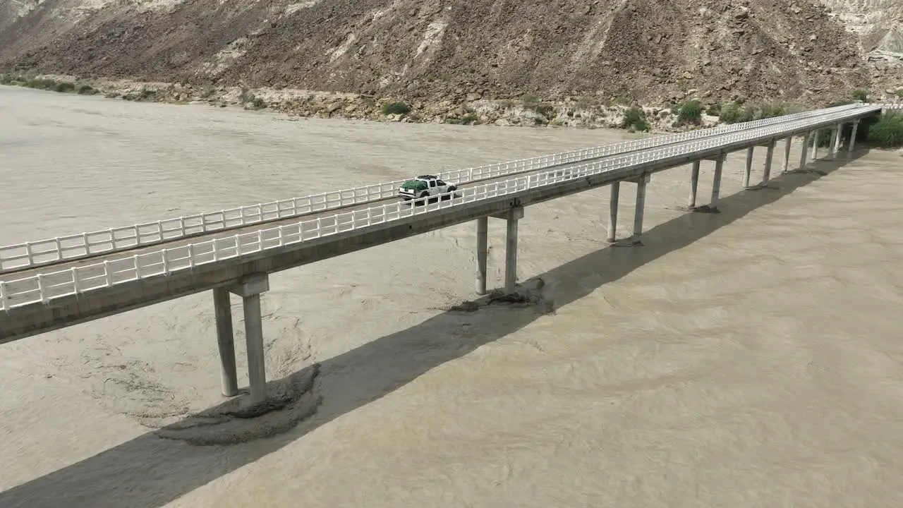 Aerial View Of Truck Driving On Hingol River Bridge