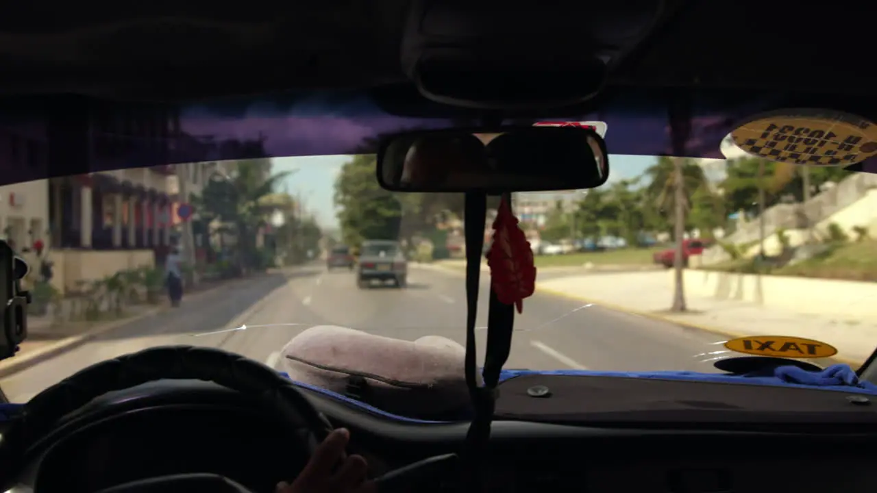 POV From Inside Cuban Taxi Driving Along Road In Havana