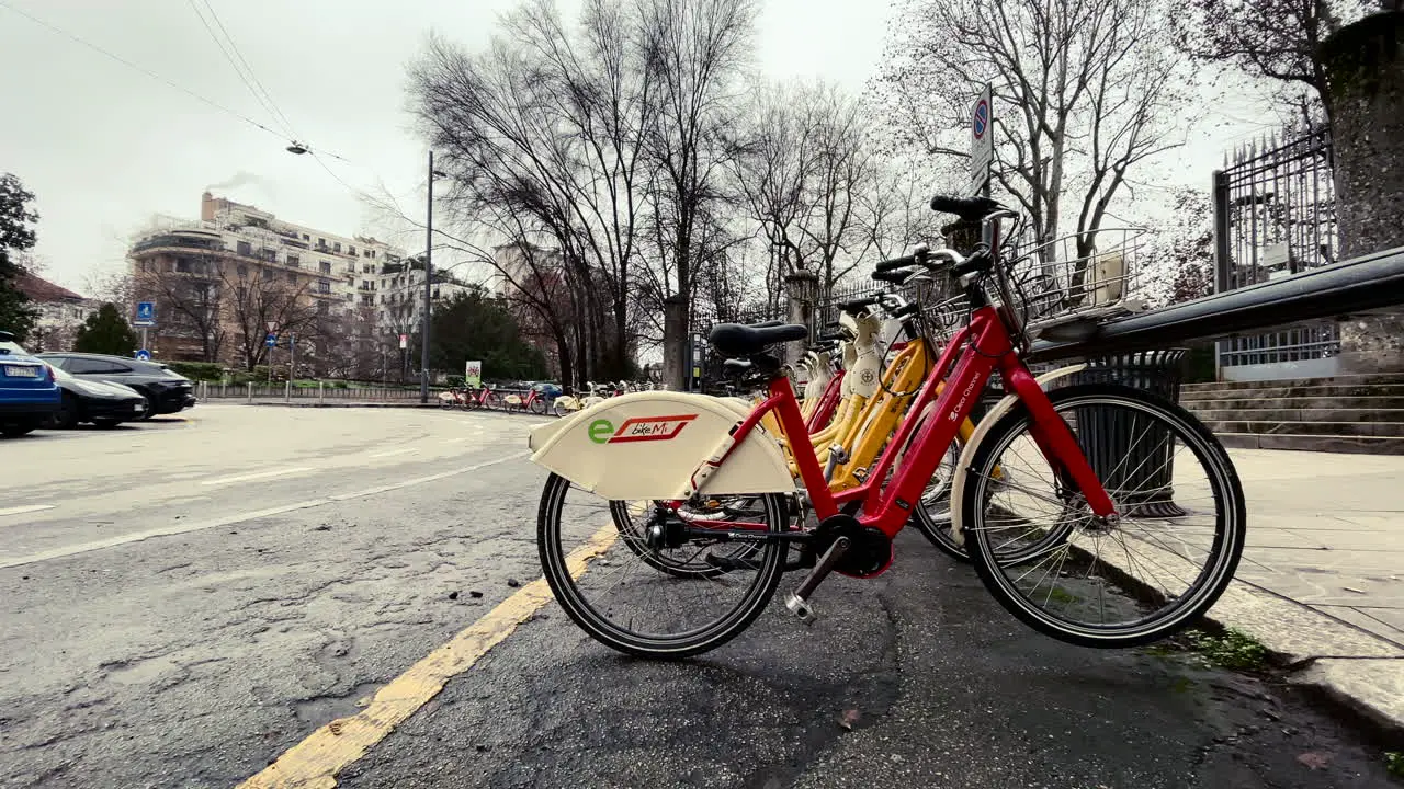 Bike Mi public transportation bikes parked on street in Milan Italy