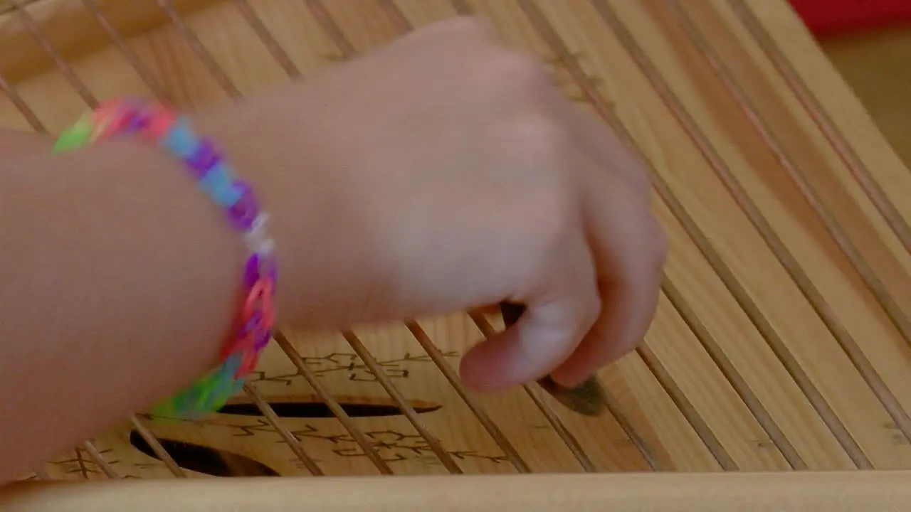 String instrument lute girl playing on lute children hands visible