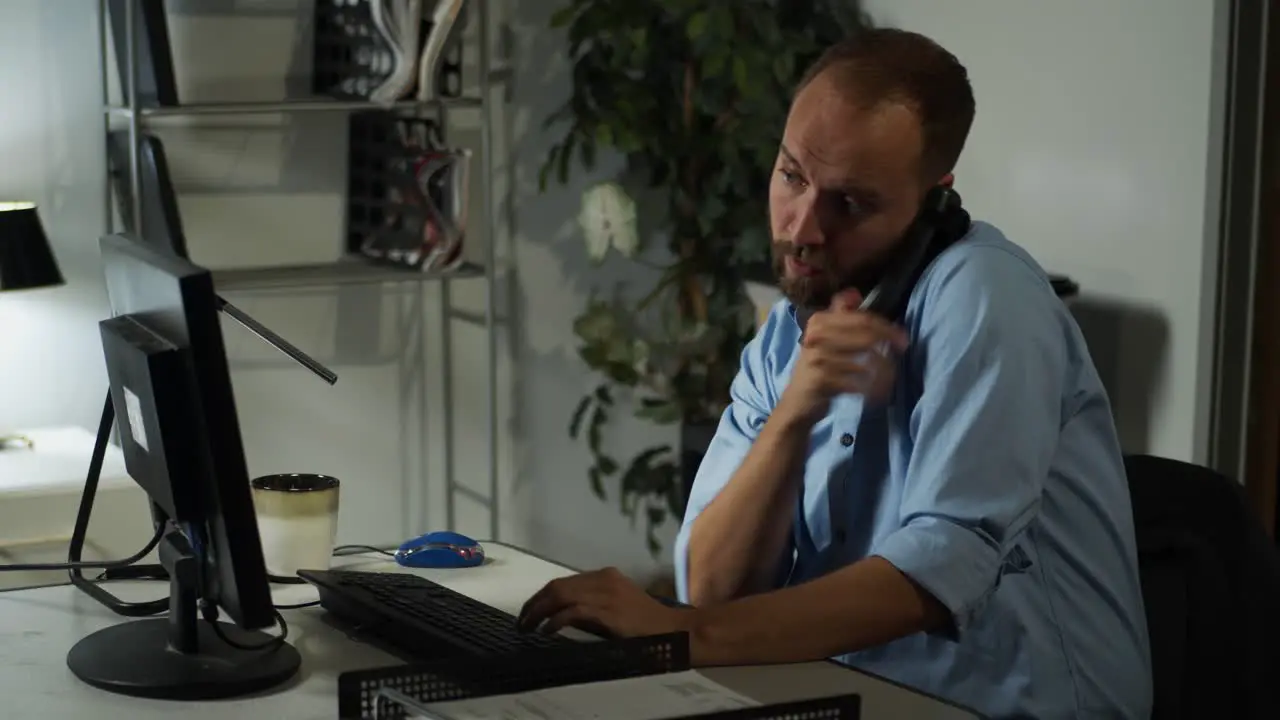 Male office worker working late