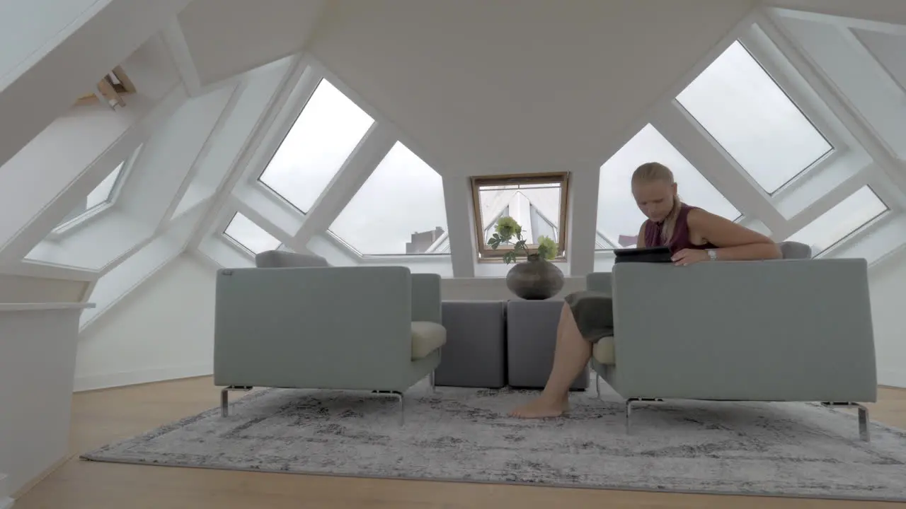 Woman with pad in the room of Cube House