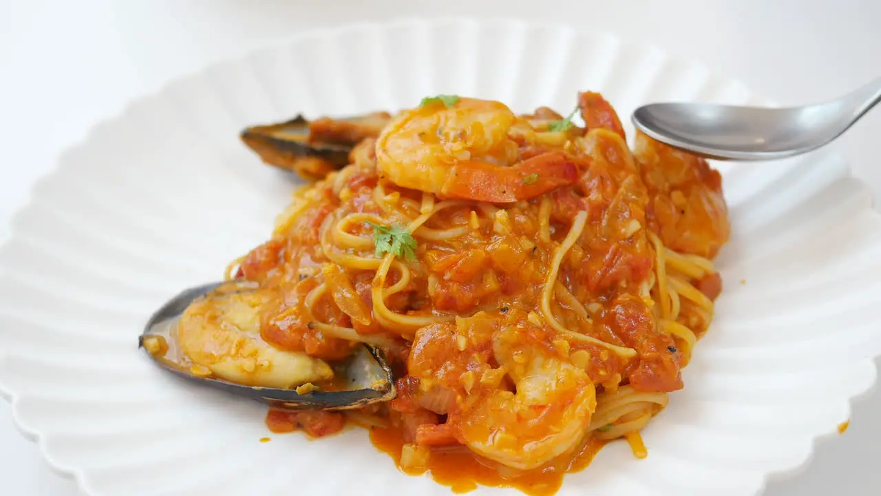 Plate of sea food pasta on table