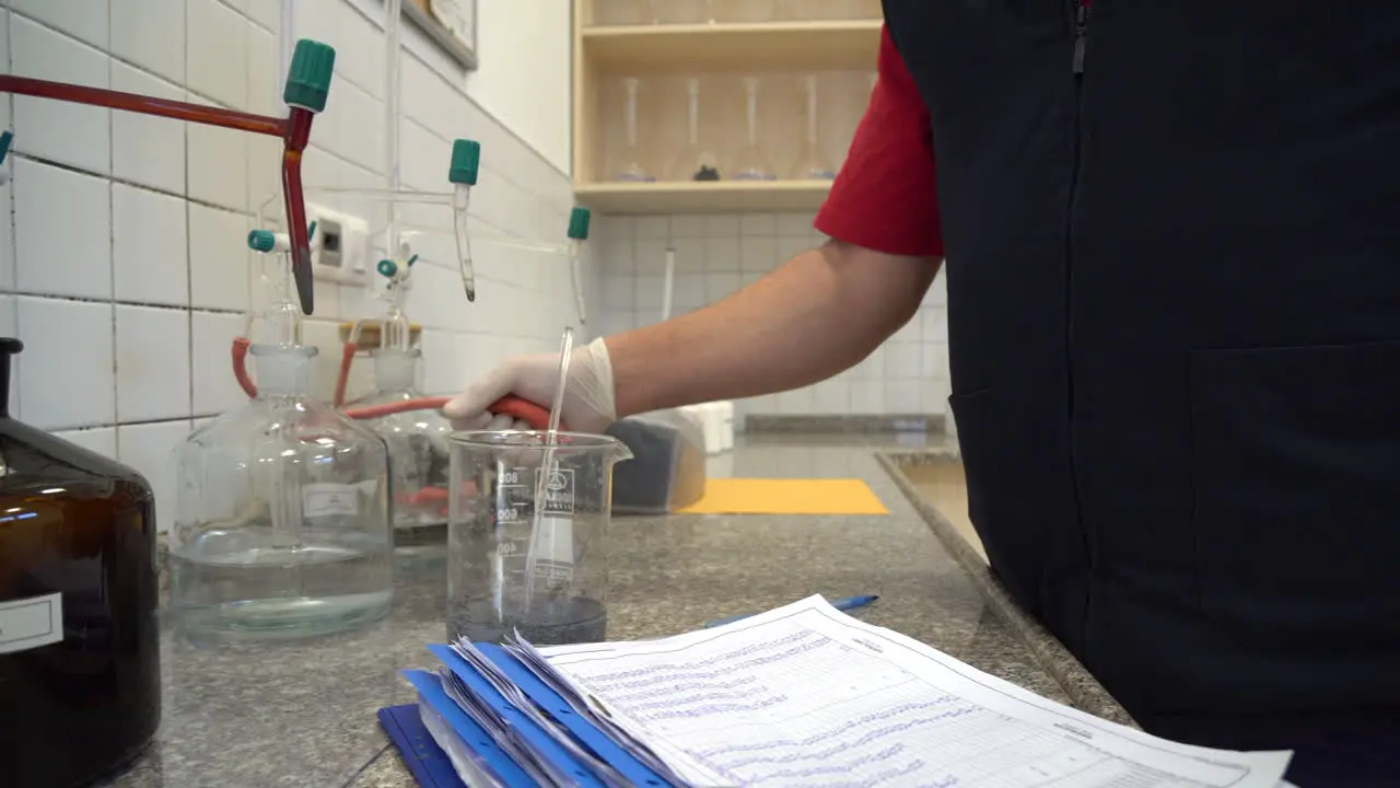 Laboratory assistant takes water samples in the laboratory