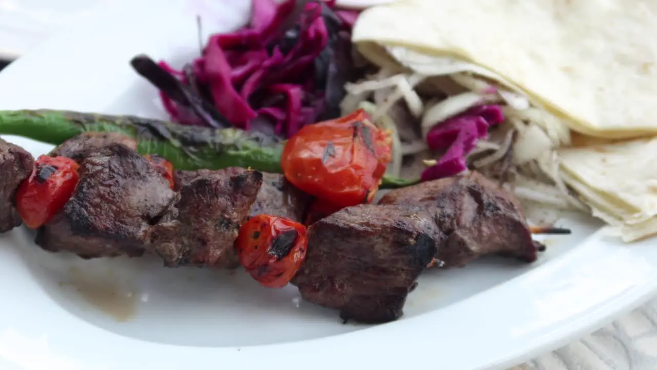 Seekh kabab bread and sauce on a plate