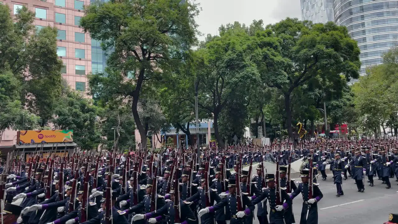 shot of the advance of the sniper platoon of the armed navy during the parade of the mexican army in mexico city on paseo de la reforma avenue