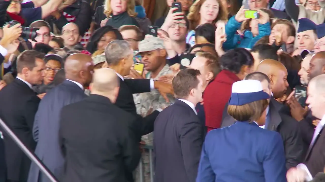 President Barack Obama And Michelle Obama Are Warmly Greeted By Members Of The Military