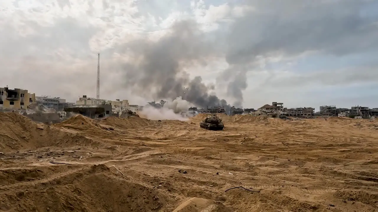 Tank firing at destroyed city Israel Palestine conflict in Gaza