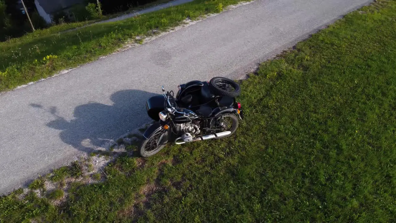 Zoom out aerial black vintage Ural motorcycle