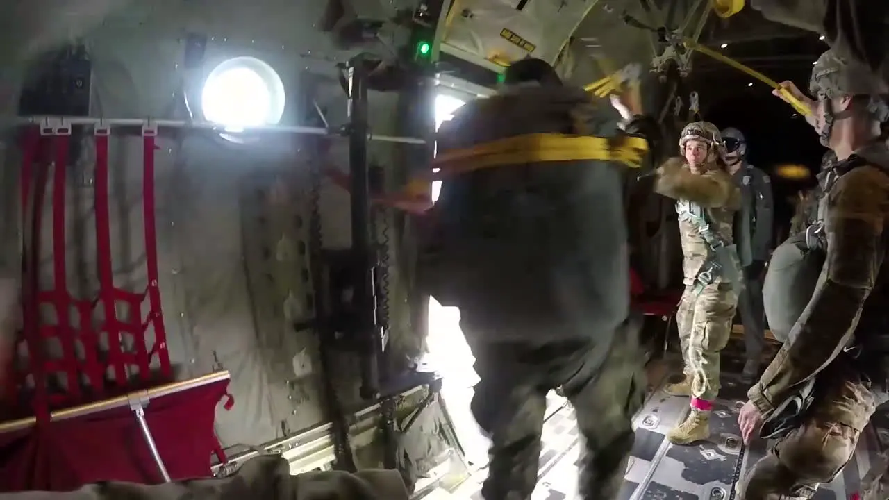 Pov Shot Of A Paratrooper Jumping From A Military Airplane