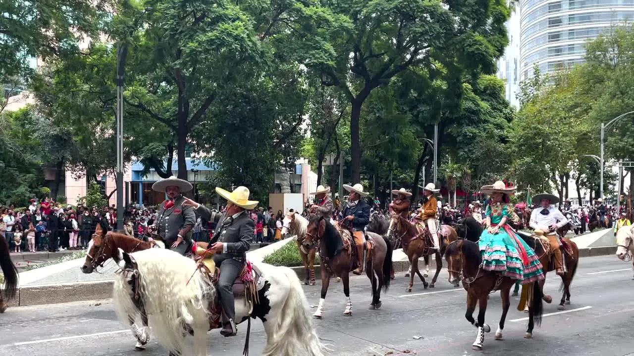 shot of the mounted police parade from the high mountains of mexico city with fine horses