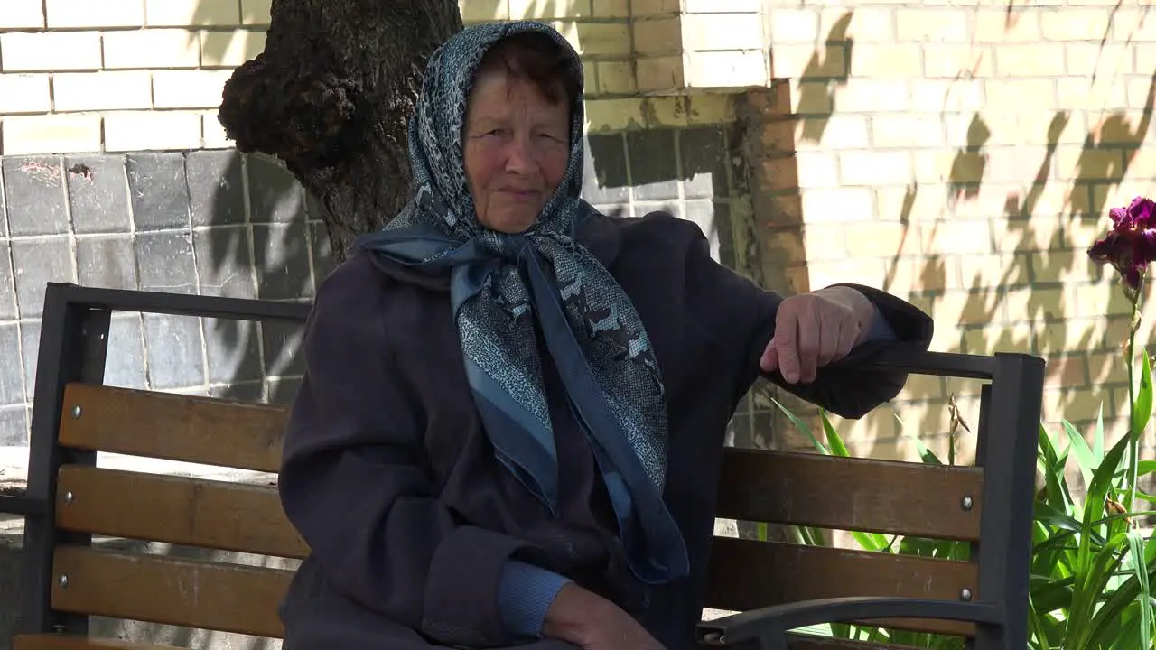 An Old Babushka Woman Contemplates Her Fate On The Streets Of Bucha Ukraine Following The Russian Invasion