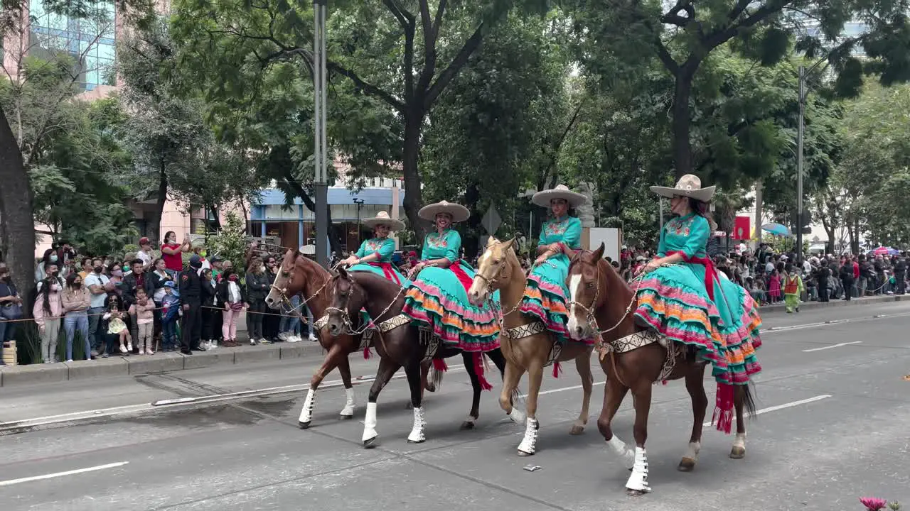 shot of the charro women of mexico city during the military parade of mexico city