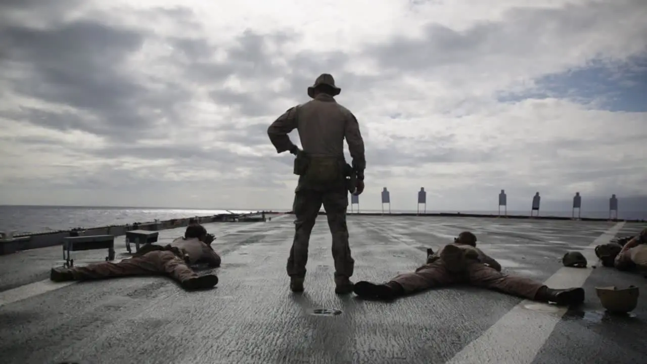 Us Marines Deployed Aboard the Amphibious Dock Landing Ship Uss Comstock Conduct A Livefire Range Exercise