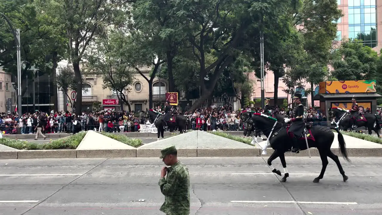 shot of the mounted elite guards advancing during the military parade in mexico city