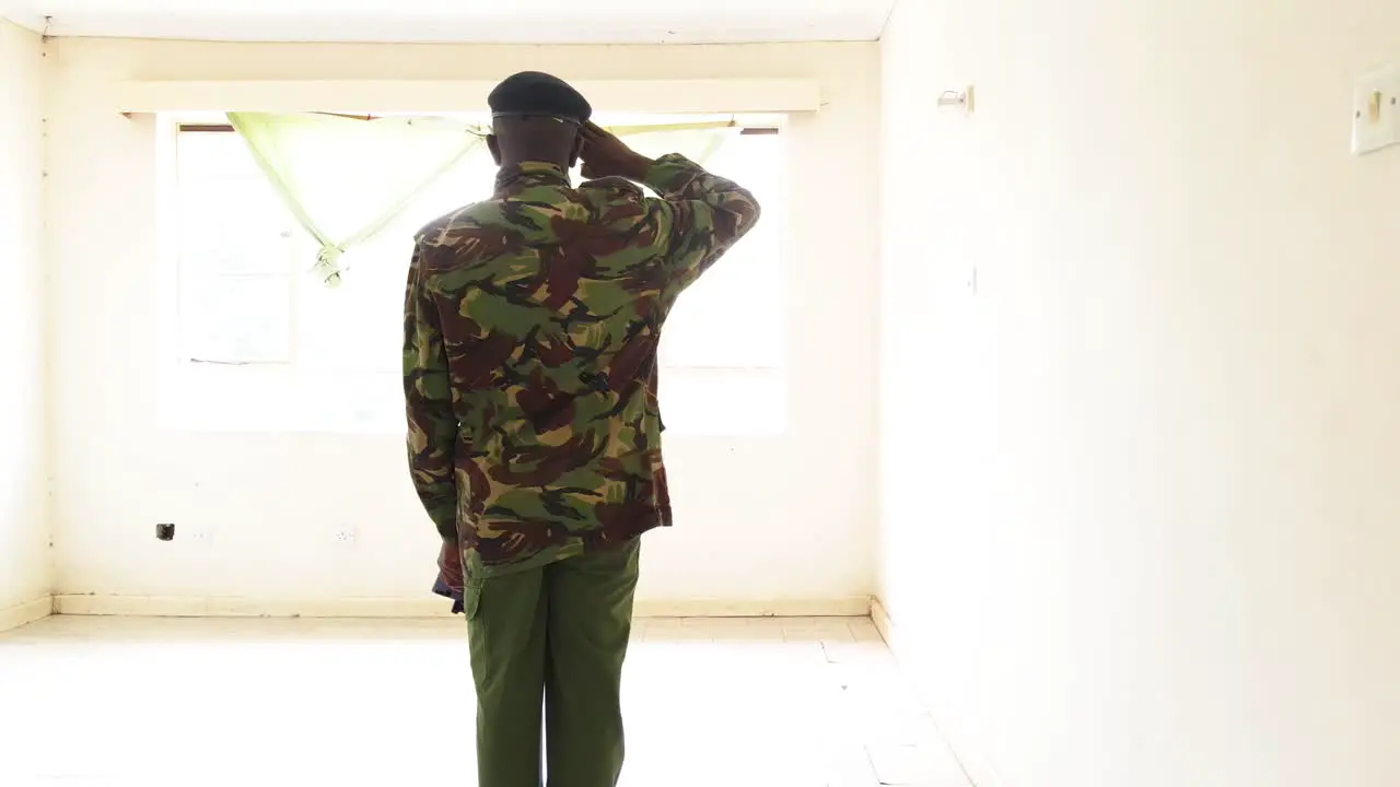 Kenya military man working inside the house