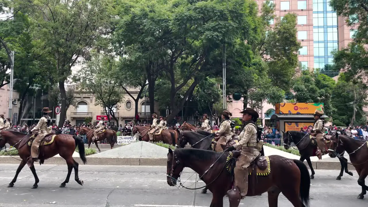 shot of the mounted police parade from the high mountains of mexico city