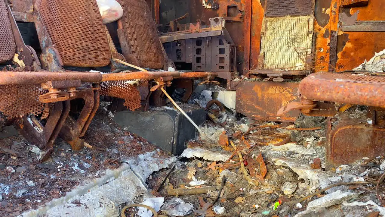 Fully burned and destroyed inside of a war vehicle in Mykhailivska Square in Kyiv Ukraine shelled car tank from Russia Ukraine war explosion damage 4K shot