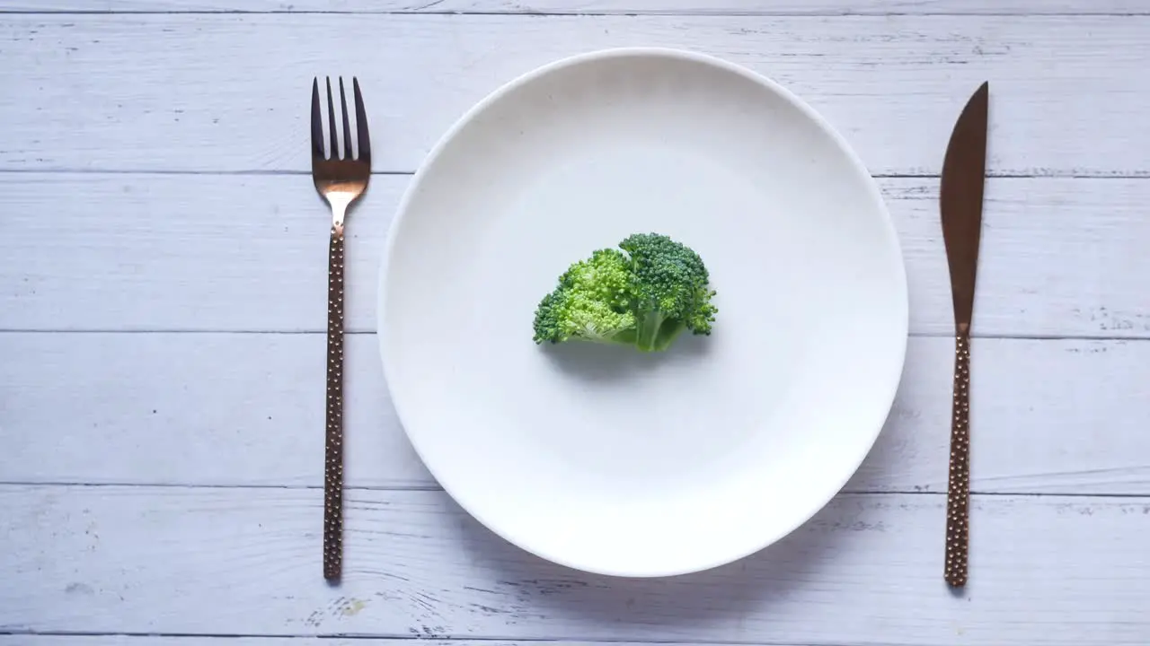 Top view of broccoli in plate on table