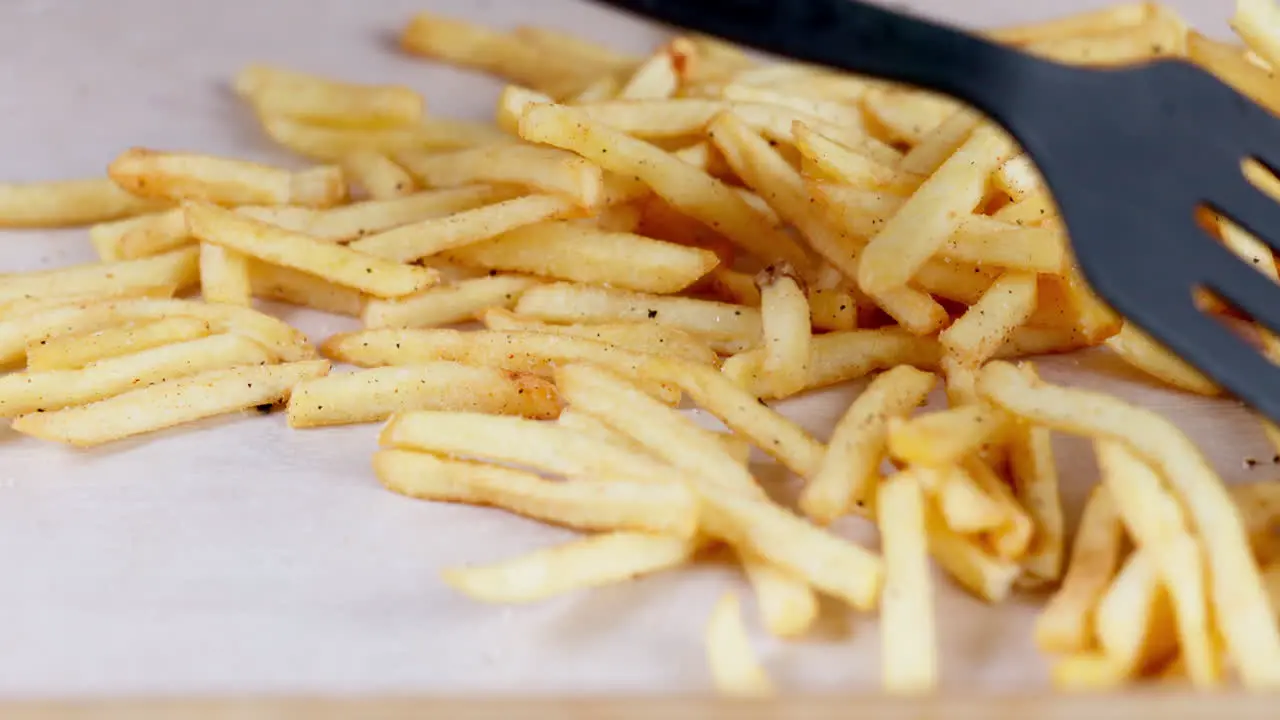 Fast food french fries and spatula for cooking