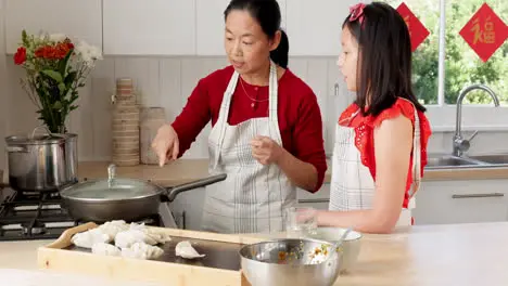 Food mother and girl cooking in a kitchen