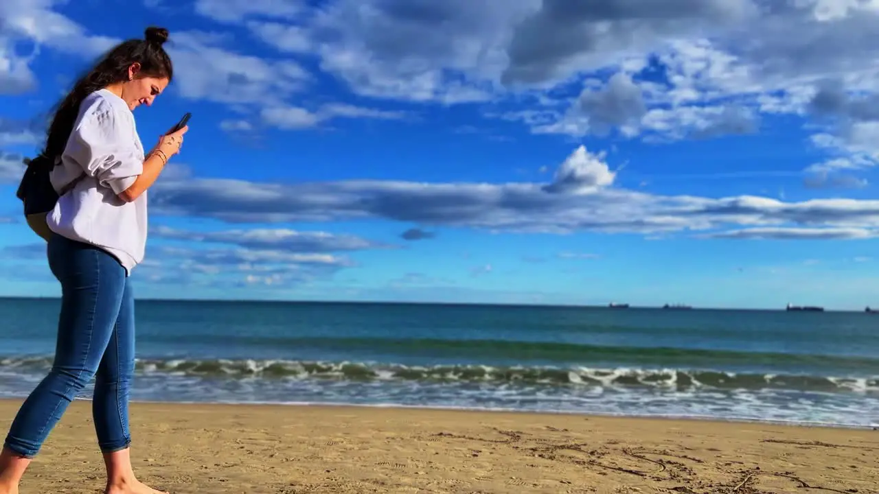 Beautiful women looking at the sea in Alicante Spain during the day