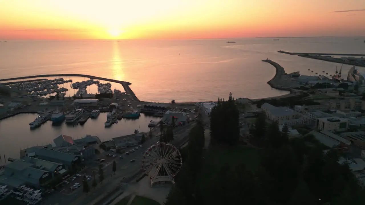 fremantle seafront at sunset with the ferris wheel in the foreground and the ocean in the background Perth Western Australia