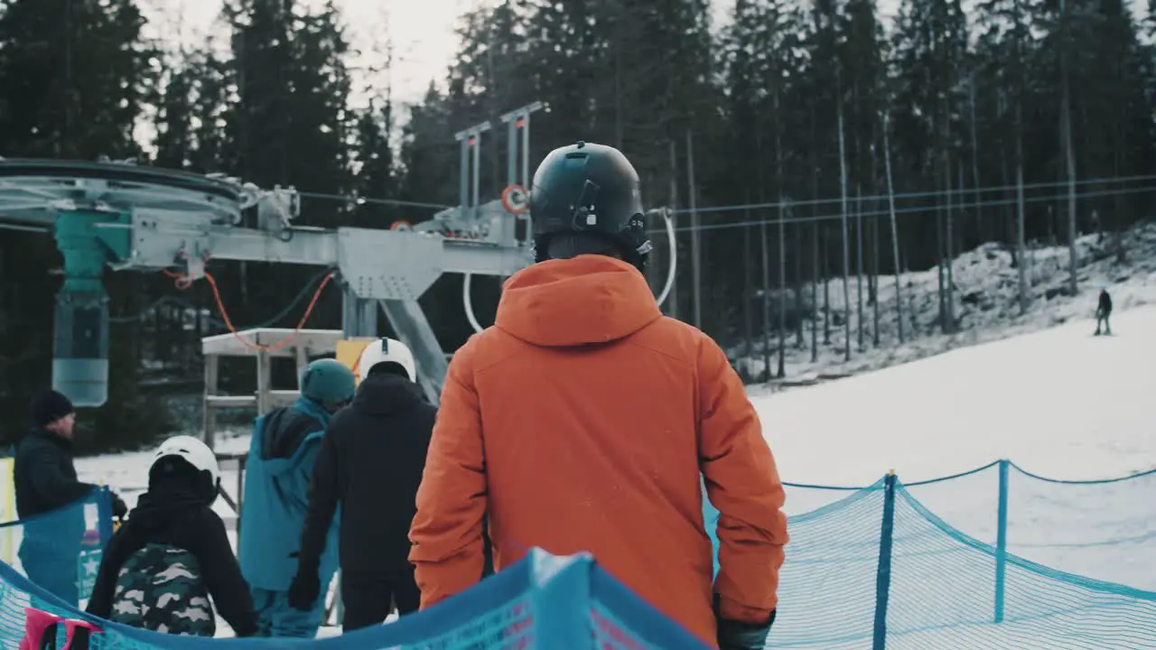 Skiers queuing up for the ski lift