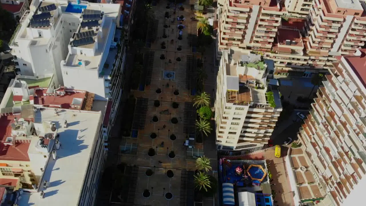 Drone shot from town square promenade in central Marbella Spain