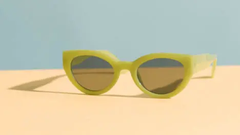 Summer Holiday Vacation Concept Of Sunglasses On Yellow Blue Background