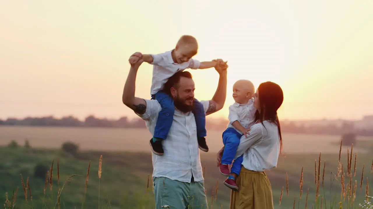 Happy Children And Their Parents Are Happy Together With The Sun Living Nature And Fresh Air Sunset