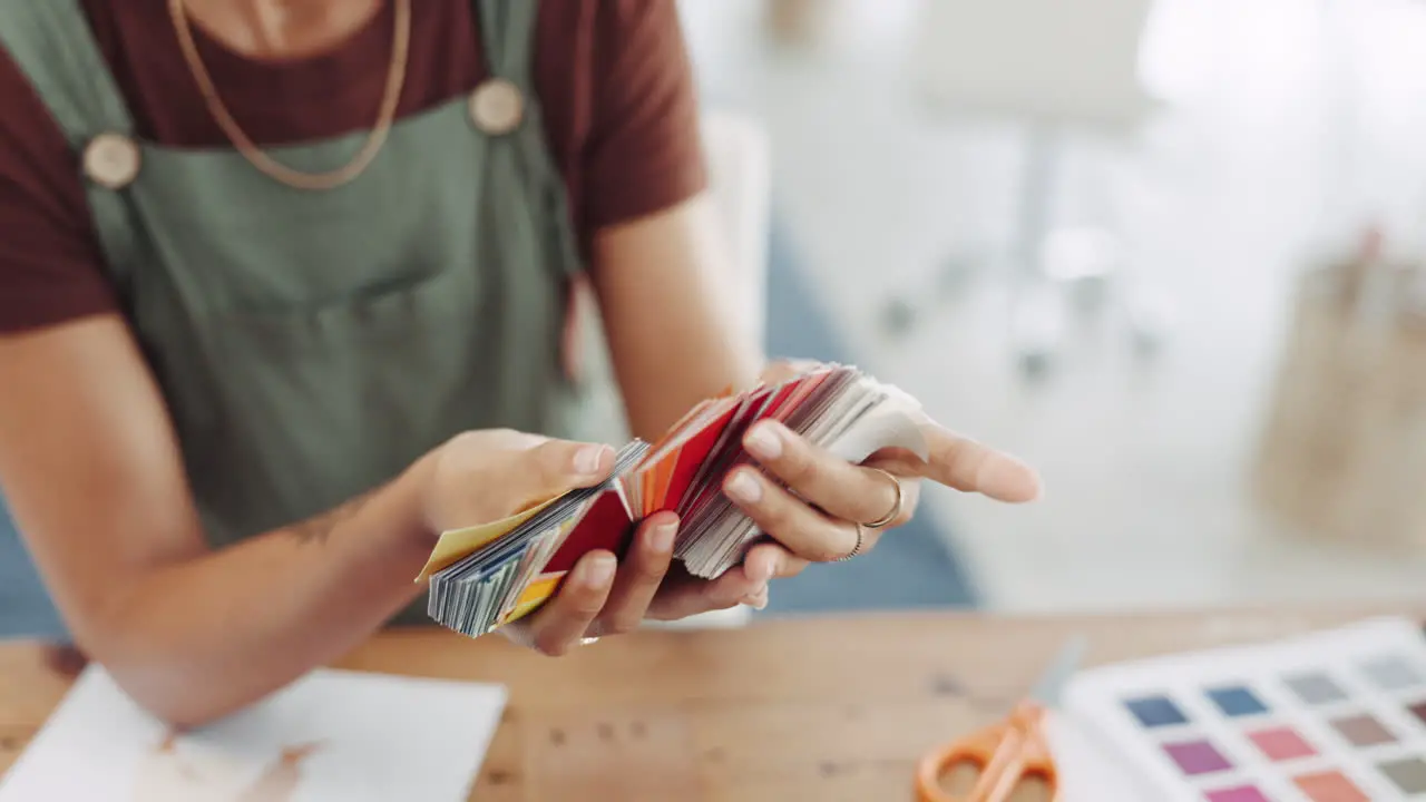 Woman hands and color swatches in small business